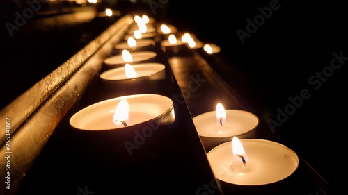 Group of candles on a base in a church