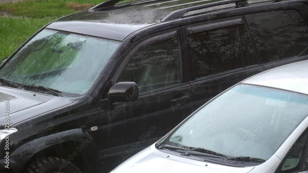 Cars in the parking lot in the rain Cars in the parking lot in the rain