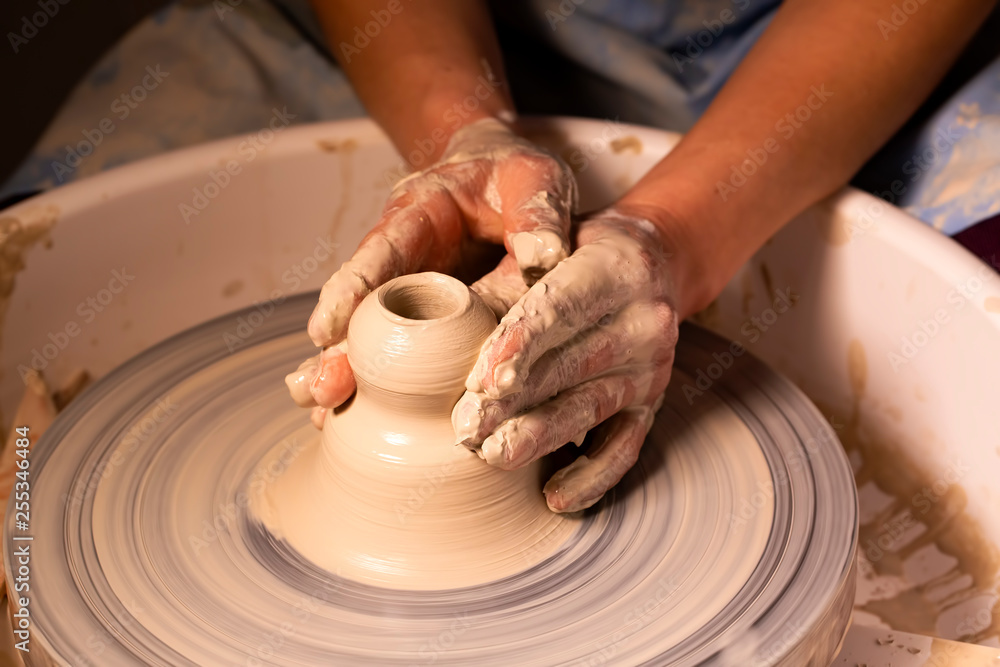 Professional potter making bowl in pottery workshop, studio. Professional potter making bowl in pottery workshop, studio.