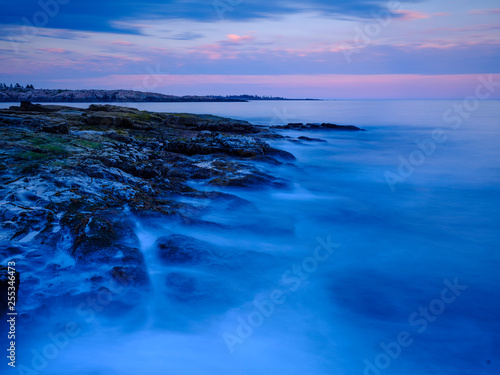 Smooth water at the beach background  © Niyada