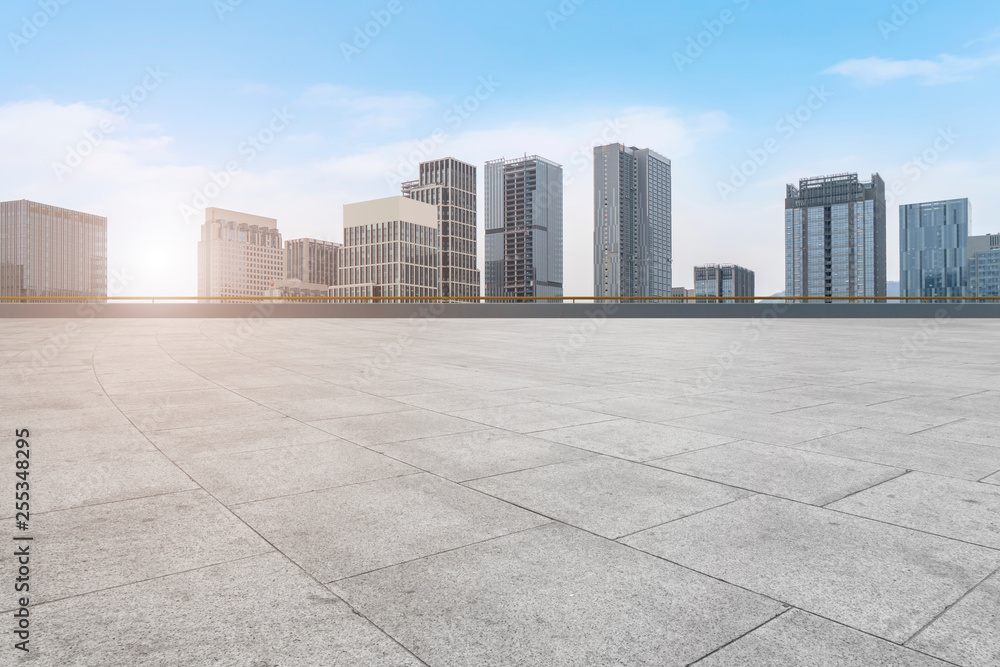 Urban skyscrapers with empty square floor tiles