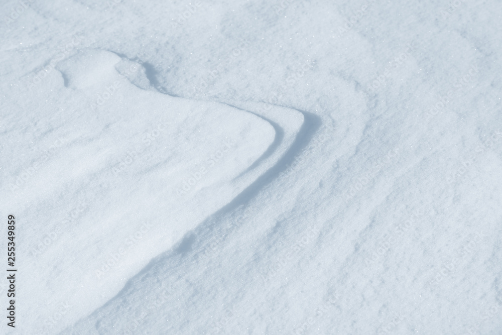 Fresh snow background texture. Winter background with snowflakes and snow mounds. Snow lumps.