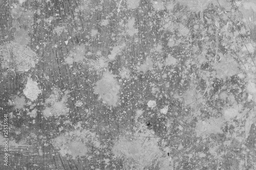 Black and white photo of old scratched linoleum spattered with white paint. Grunge texture background. Background for design