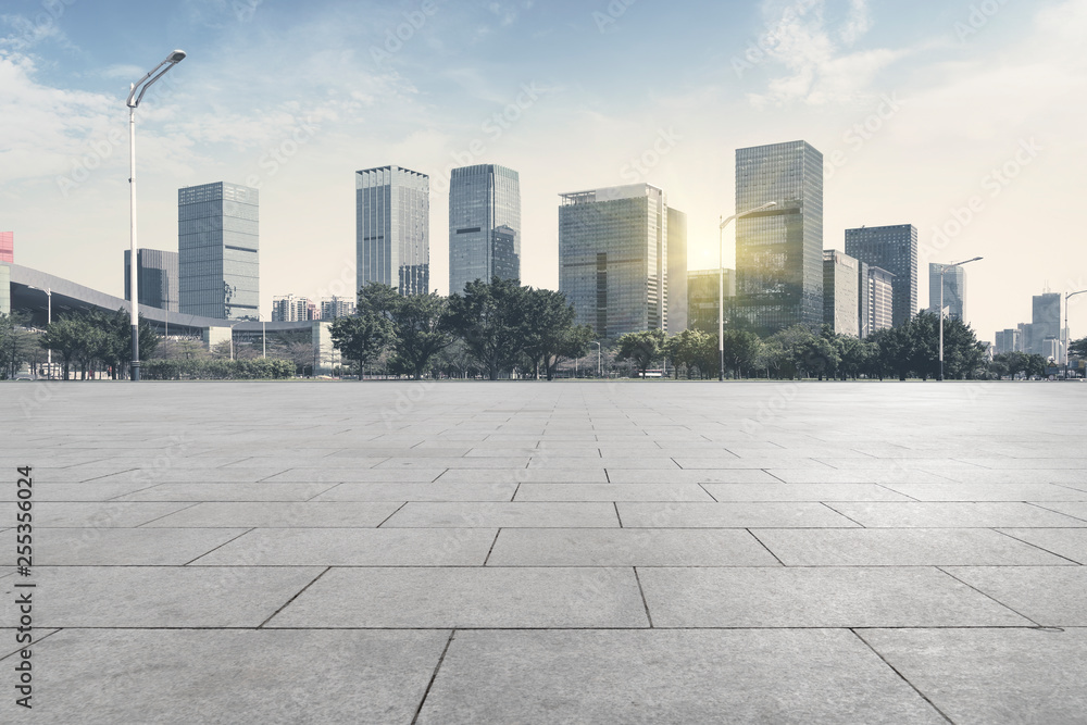 Urban skyscrapers with empty square floor tiles