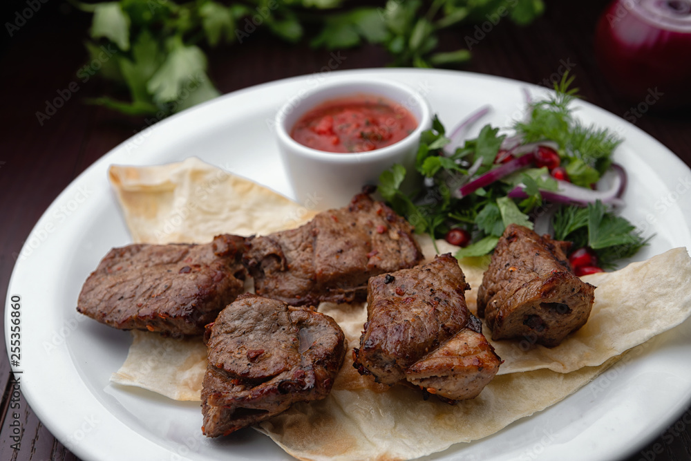 Shish kebabs on a white plate