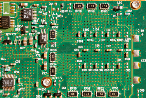 Close-up picture of green printed circuit board - PCB. Computer curcuit background. photo