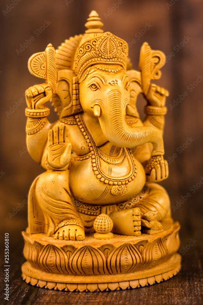 Ganesha statue on a wooden background Ganesha statue on a wooden background