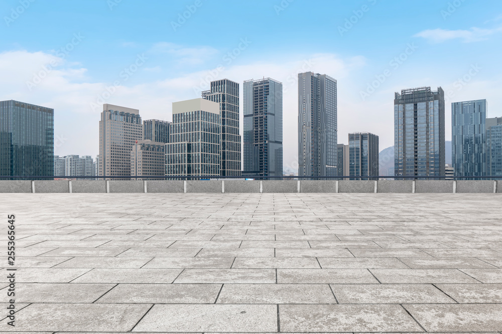 Urban skyscrapers with empty square floor tiles Urban skyscrapers with empty square floor tiles