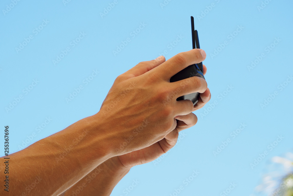 Crop man holding a remote control from a copter. Crop man holding a remote control from a copter.