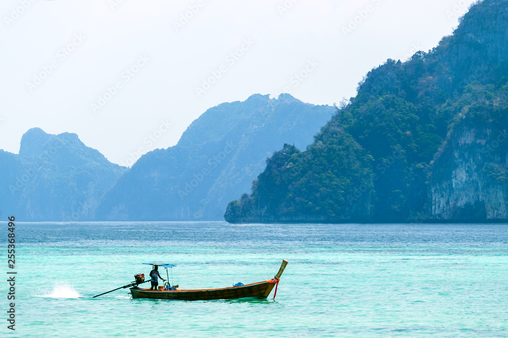 Beautiful landscape with traditional boat on the sea in Phi Phi region, Thailand. Travel, holiday in the Asia.