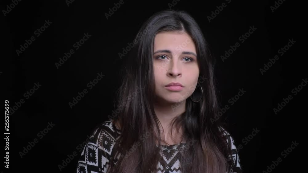 Closeup portrait of young attractive caucasian female being thoughtful in contemplation and then getting an idea smiling Closeup portrait of young attractive caucasian female being thoughtful in contemplation and then getting an idea smiling
