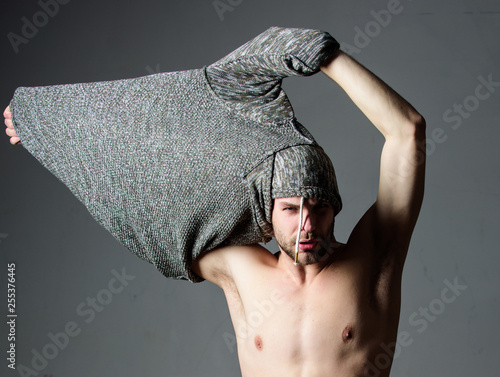 Bohemian sexy body. Object of desire concept. Caught in state of undress. Man handsome sexy hipster undressing. Guy sexy muscular torso take off clothes grey background. Seductive macho feeling sexy