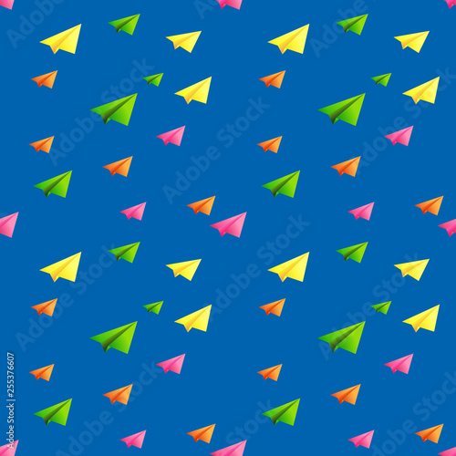 seamless pattern of multi-colored paper airplanes on blue background