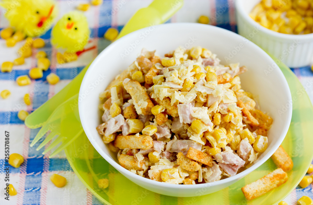 Mixed salad from ham, cheese, boiled egg, canned corn and bread crusts with mayonnaise dressing for Easter dinner Mixed salad from ham, cheese, boiled egg, canned corn and bread crusts with mayonnaise dressing for Easter dinner