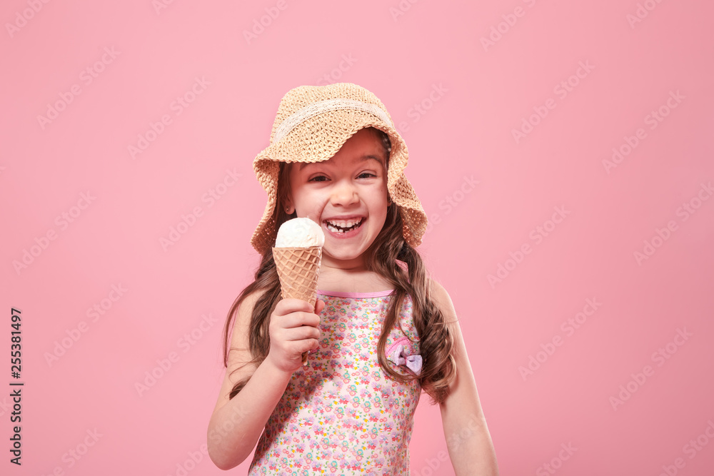 Portrait of a little cheerful girl with ice cream on a colored background Portrait of a little cheerful girl with ice cream on a colored background