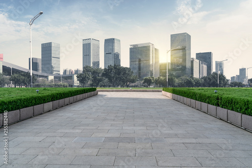 Urban skyscrapers with empty square floor tiles