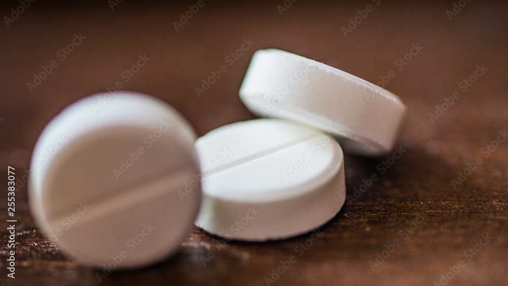 White, green, pink, orange capsules pill spilled out from white plastic bottle container. Global healthcare concept. Antibiotics drug resistance. Antimicrobial capsule pills and thermometer. Pharmaceu White, green, pink, orange capsules pill spilled out from white plastic bottle container. Global healthcare concept. Antibiotics drug resistance. Antimicrobial capsule pills and thermometer. Pharmaceu