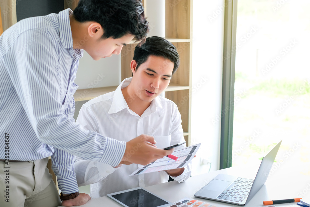 Young man designers planning work together on website ux app development. Young man designers planning work together on website ux app development.