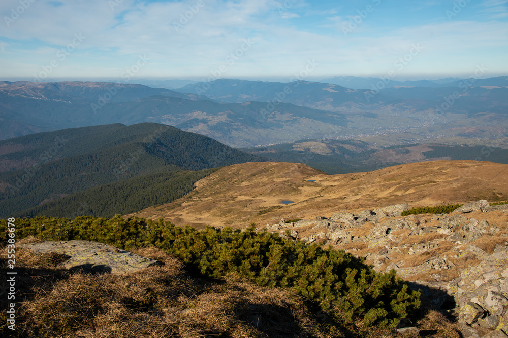 Panoramic view of idyllic mountain scenery in sunny day