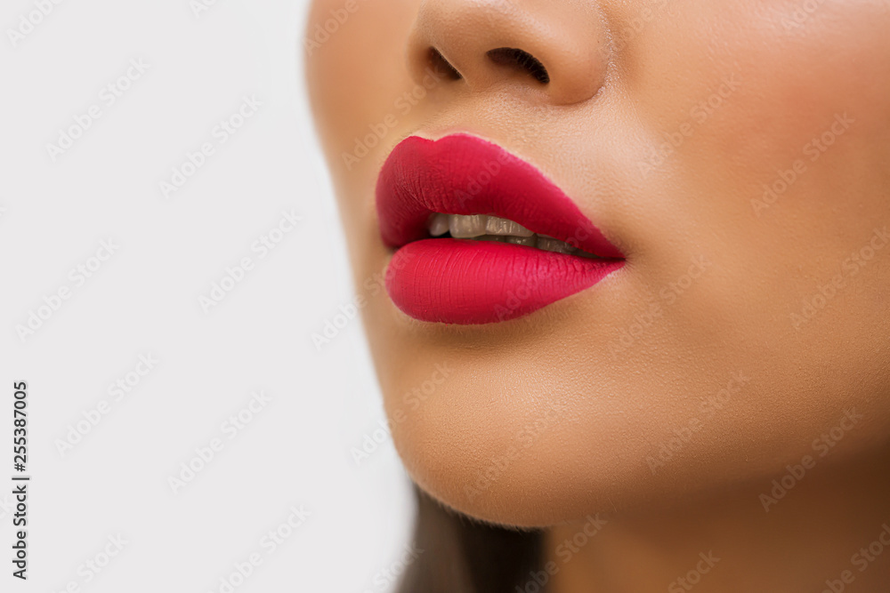 Fototapeta premium Closeup of red lips of woman with bright lipstick