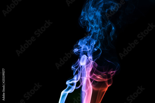 Abstract backgrounds and wallpapers. Colorful smoke on black background..