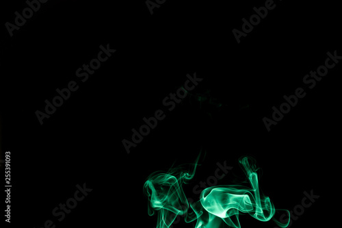 Abstract backgrounds and wallpapers. Colorful smoke on black background..