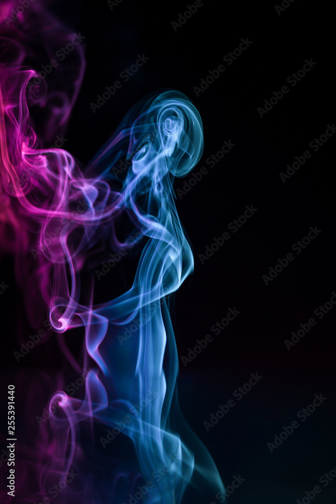 Abstract backgrounds and wallpapers. Colorful smoke on black background.. Abstract backgrounds and wallpapers. Colorful smoke on black background..