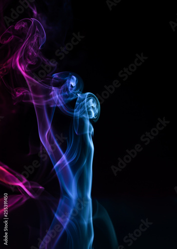 Abstract backgrounds and wallpapers. Colorful smoke on black background..