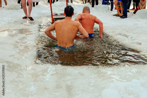 Men swimming in the hole.