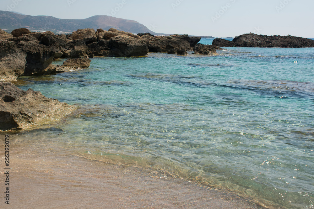 Falasarna beach, Crete Island landmark. Paradise beach with turquoise water and pink sand, Greece