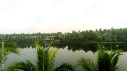 Kid on pirogue on Bassam laguna photo