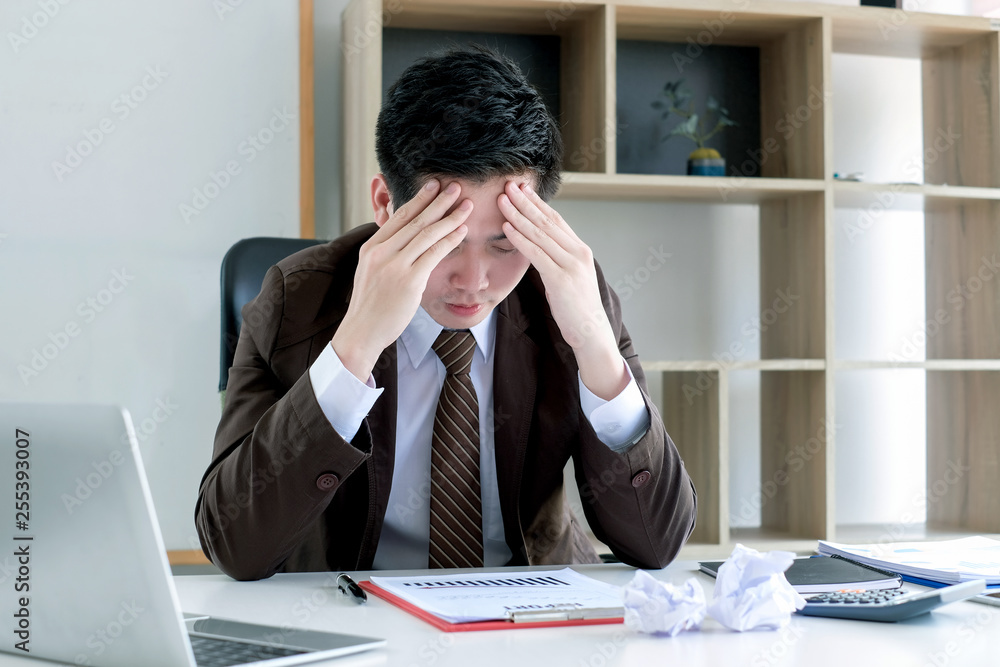 Feeling tired. Young asian businessman feeling stress from work. Feeling tired. Young asian businessman feeling stress from work.