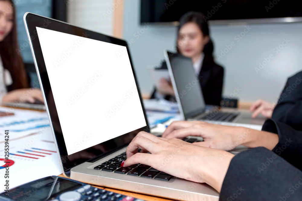 Business woman using a computer laptop at meeting. Business woman using a computer laptop at meeting.