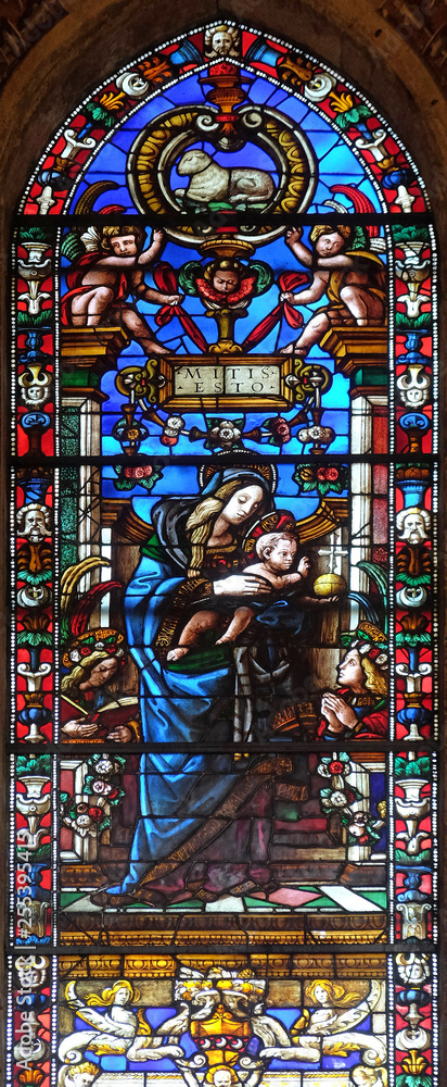 Madonna and Child stained glass window by Filippino Lippi, Filippo Strozzi chapel in Santa Maria Novella church in Florence, Italy