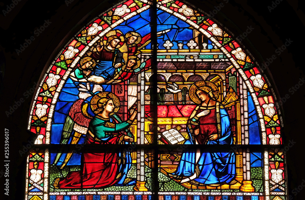 Annunciation to the Virgin Mary stained glass window in Santa Maria Novella Principal Dominican church in Florence, Italy