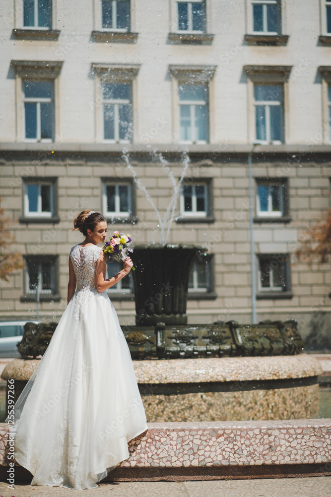 Bride with bouquet in the city