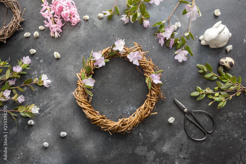 Spring wreath with flowers. Creative flat lay. View from above.