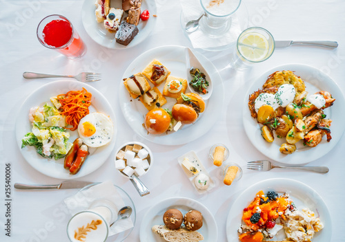 Breakfast Buffet Concept, Breakfast Time in Luxury Hotel, Brunch with Family in Restaurant, Top View of the Table with Plates of Food for Breakfast - Image