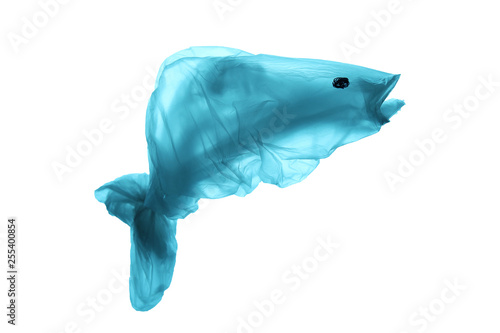 Pollution of the world's oceans with plastic garbage. Blue fish out of waste. Recycling and the ban on the use of polyethylene. Isolated on white background.