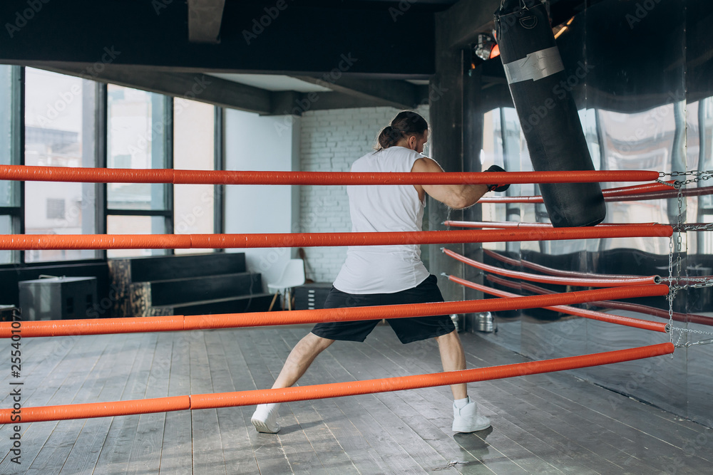 Male Boxer enters the ring and prepares for the fight