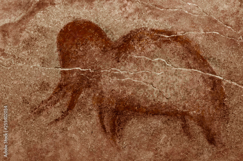 The image of an ancient mammoth on the cave wall. history of antiquities, archaeology.