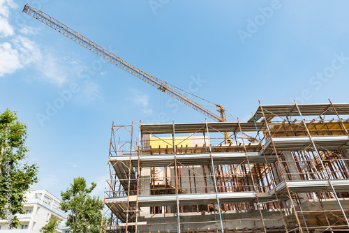 Scaffolds and cranes in a construction site