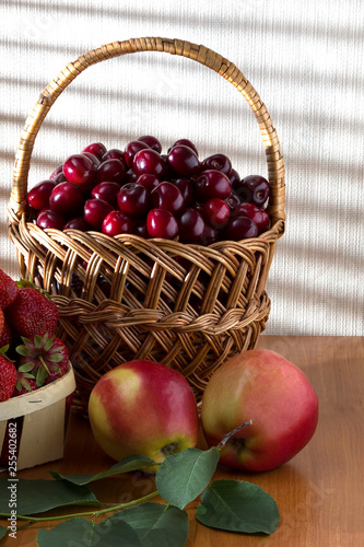 Juicy apples and ripe berries of cherries and strawberries - a sea of vitamin from nature.