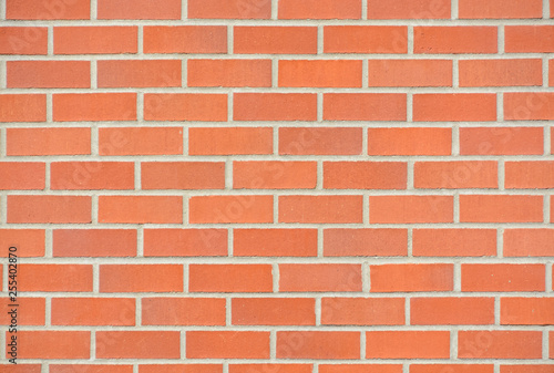 New red brick wall texture background with grey grout filling