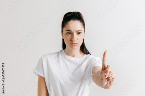 Businesswomans finger touching empty space  modern business background concept - can be used for insert search bar  text or pictures.