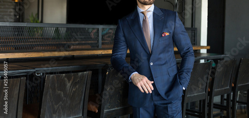фотографія Man in expensive custom tailored suit standing an posing indoors