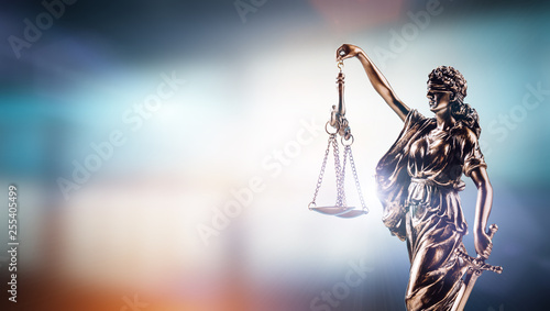 Themis, symbol of law on modern background. photo