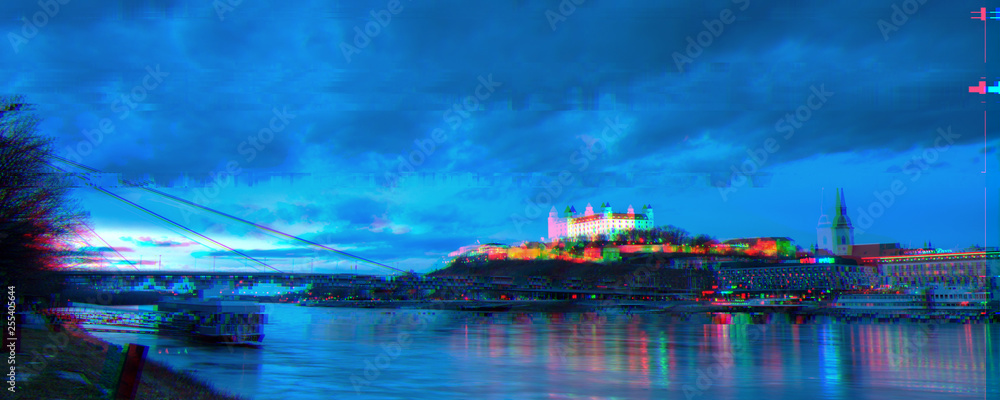 glitch effect night view of Bratislava castle from river surface with dramatic sunset skyline