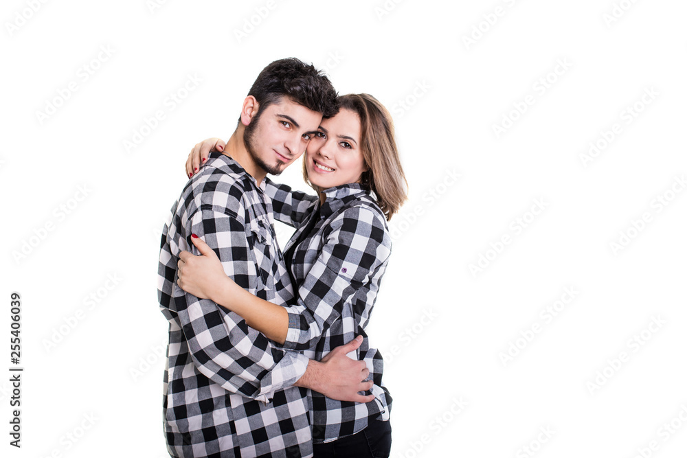 Couple in skirts hugging isolated on white Couple in skirts hugging isolated on white