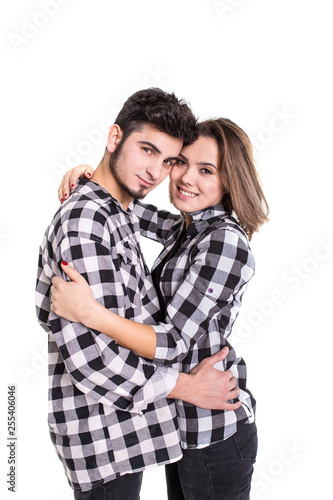 Couple hugging and smiling isolated on white